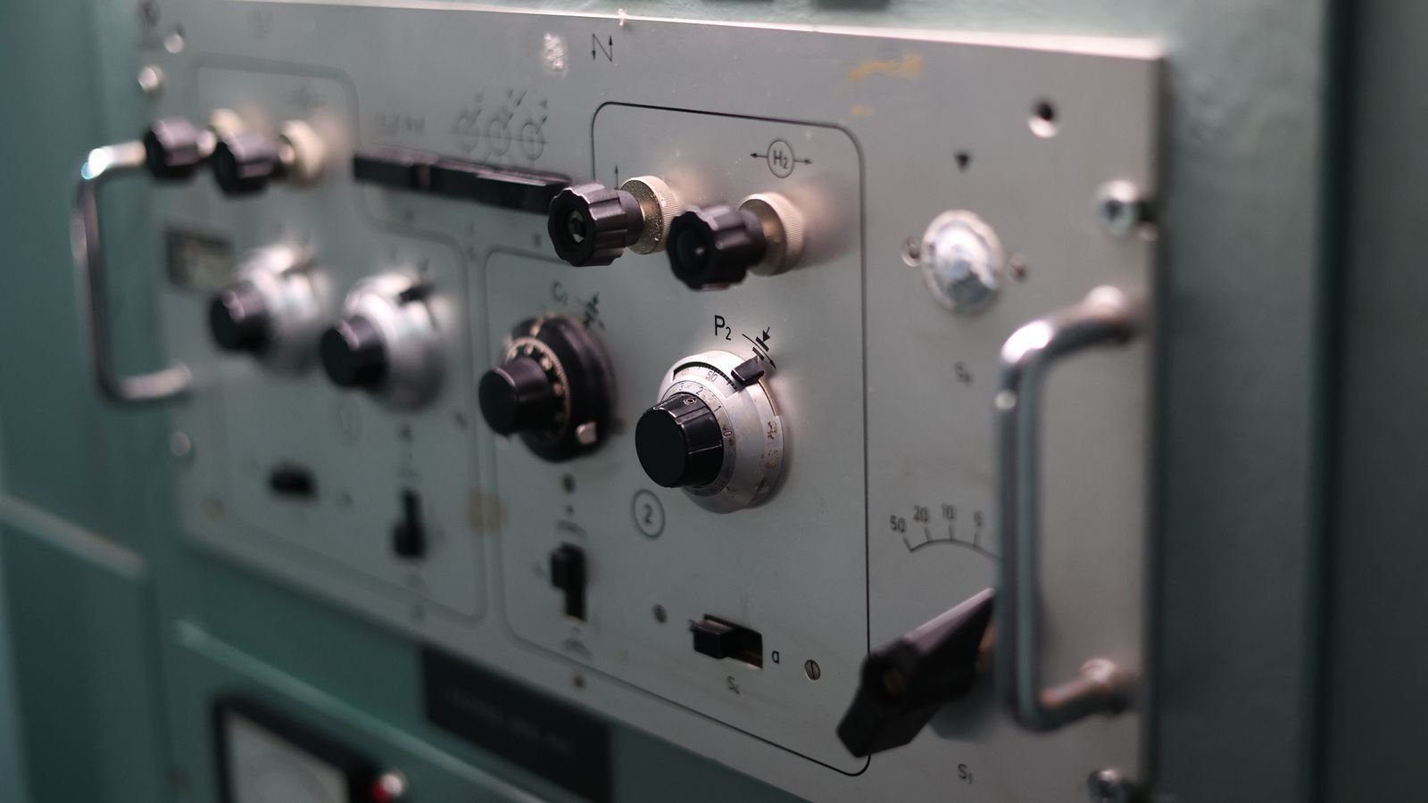 Close-up of industrial machine switches representing Titania DIP switch configuration and commissioning